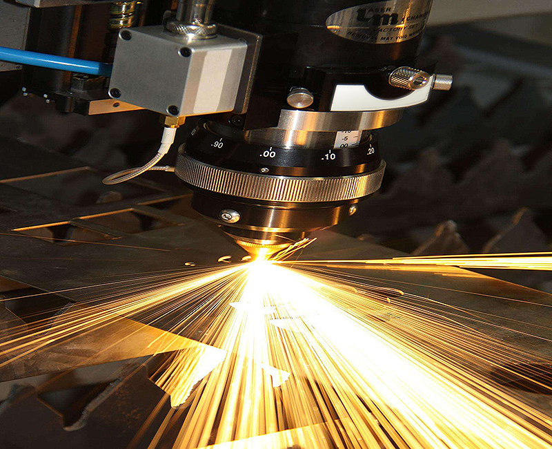 How can the user of the laser cutting machine prevent the radiation generated by the laser