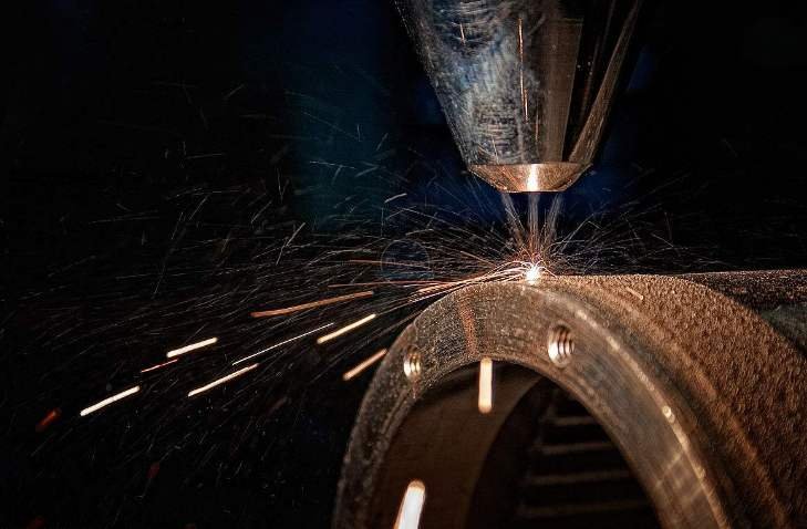 How can the user of the laser cutting machine prevent the radiation generated by the laser